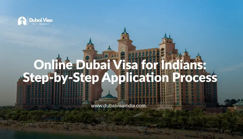 A wide view of a famous Dubai waterfront resort with palm trees and calm water in front.